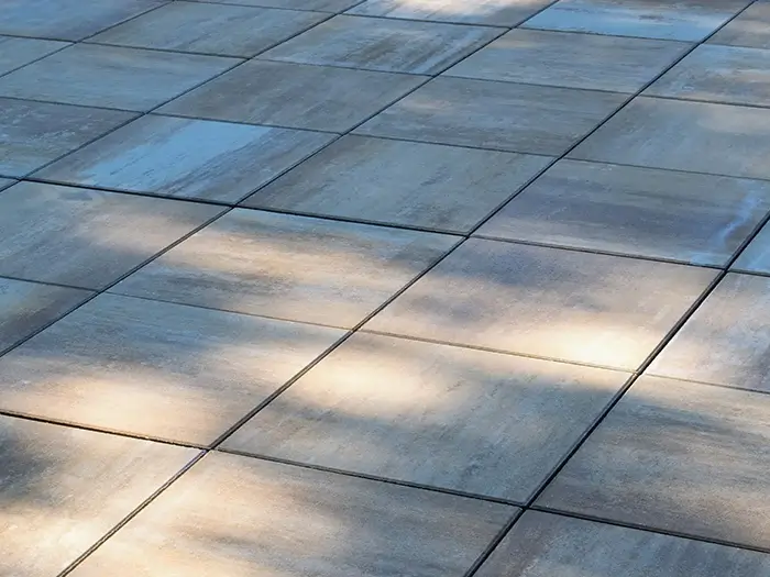 Pool deck resurfacing with slip-resistant porcelain pavers in Maple Valley, WA